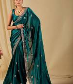 Teal ethnic motifs embroidered organza saree