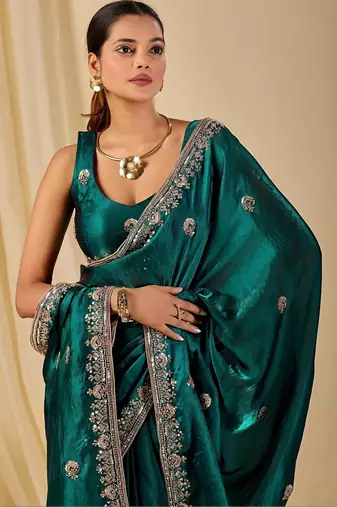 Teal ethnic motifs embroidered organza saree