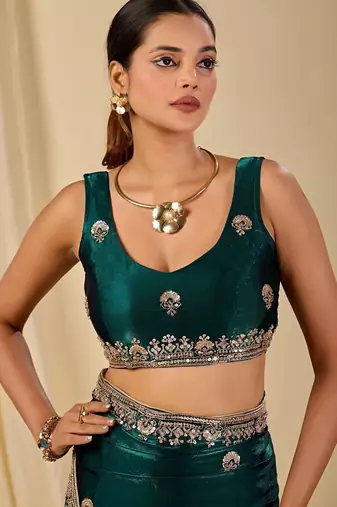 Teal ethnic motifs embroidered organza saree