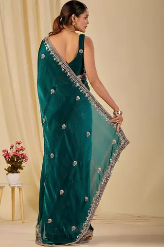 Teal ethnic motifs embroidered organza saree
