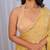 Yellow sequinned silk cotton saree