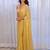 Yellow sequinned silk cotton saree