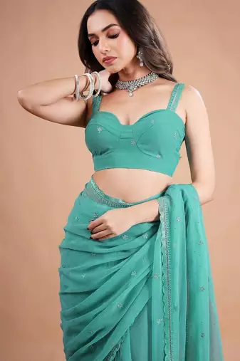 Sea green embellished sequinned  chiffon heavy work saree