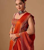 Orange embellished beads and stones satin heavy work saree