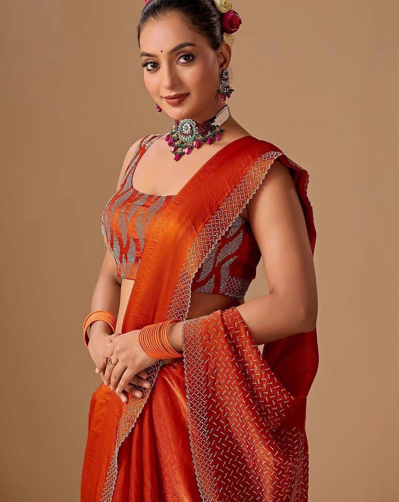 Orange embellished beads and stones satin heavy work saree