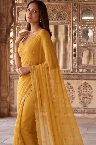 Mustard ethnic motifs embroidered poly chiffon saree