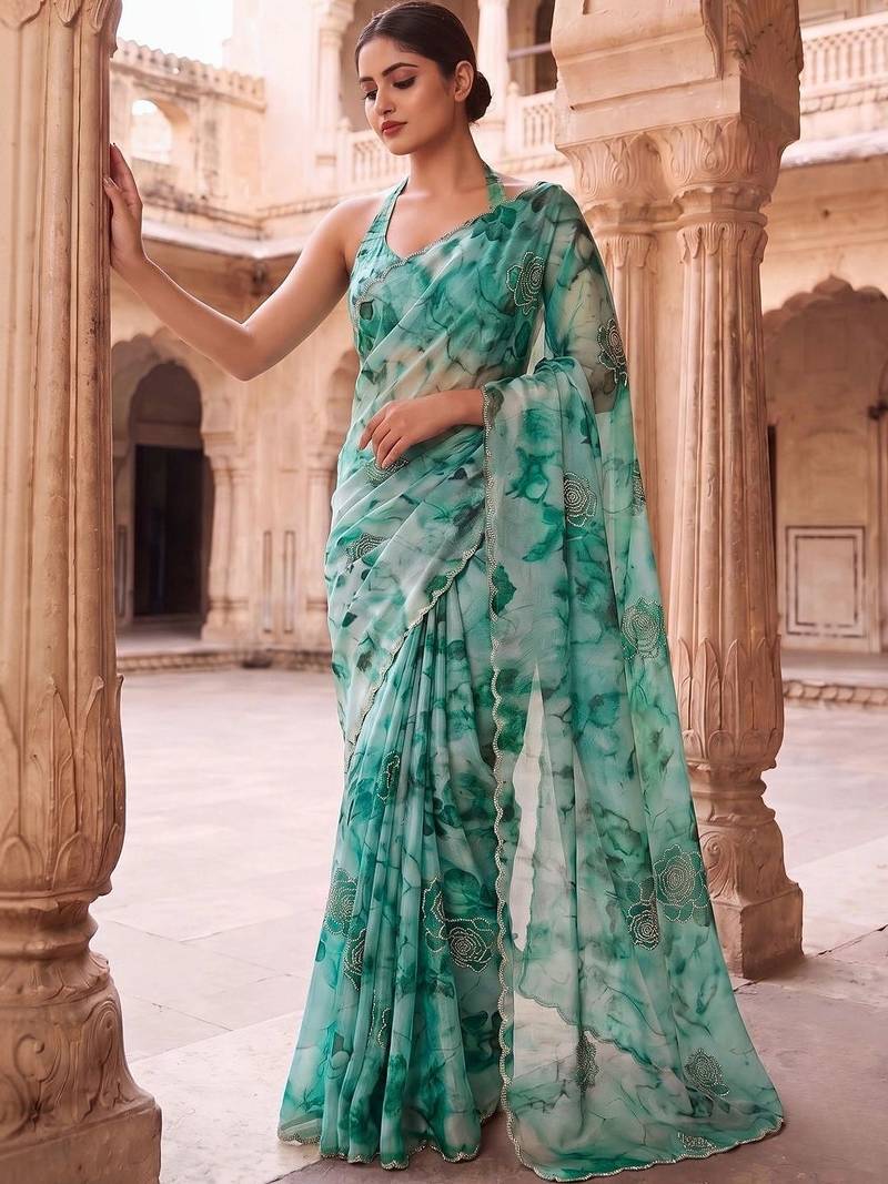 Teal embroidered organza saree