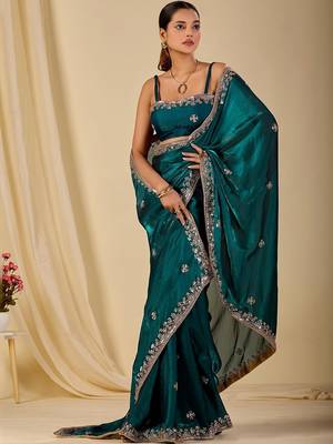 Teal ethnic motifs embroidered organza saree 1