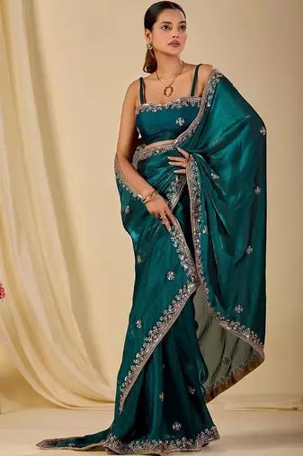 Teal ethnic motifs embroidered organza saree