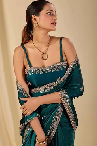 Teal ethnic motifs embroidered organza saree