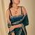 Teal ethnic motifs embroidered organza saree