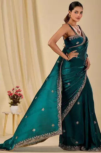 Teal ethnic motifs embroidered organza saree