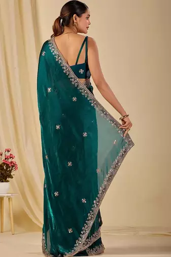 Teal ethnic motifs embroidered organza saree