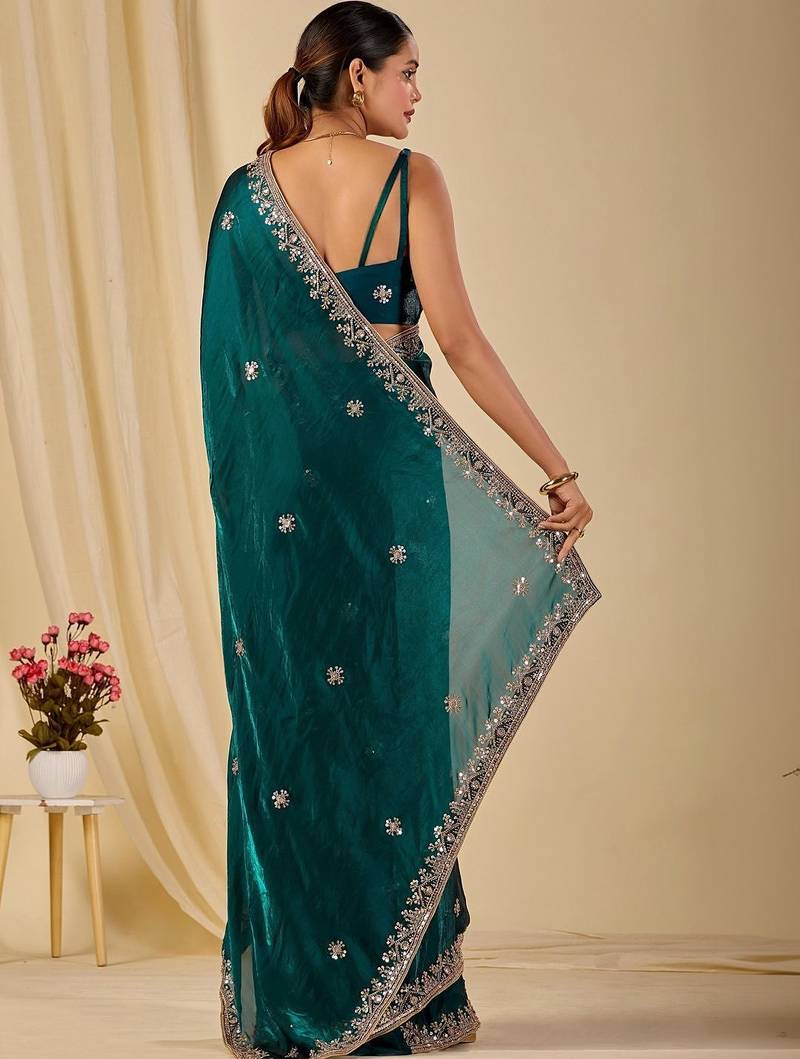 Teal ethnic motifs embroidered organza saree