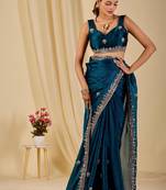 Teal floral sequinned organza saree