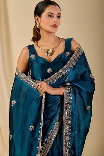 Teal floral sequinned organza saree