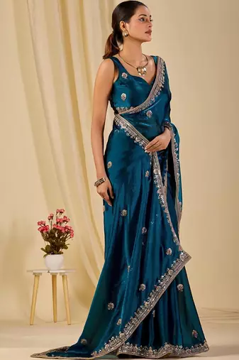Teal floral sequinned organza saree