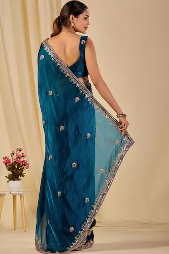 Teal floral sequinned organza saree