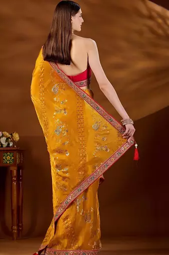 Yellow bandhani beads and stones organza saree