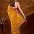 Yellow bandhani beads and stones organza saree