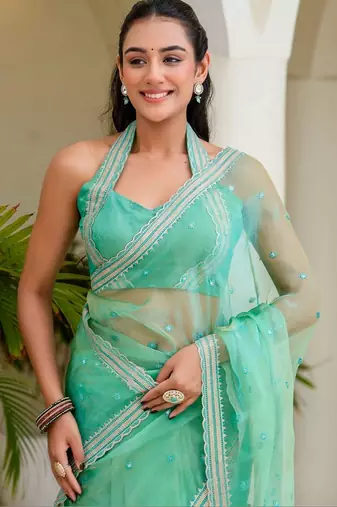 Sea green floral sequinned tissue saree