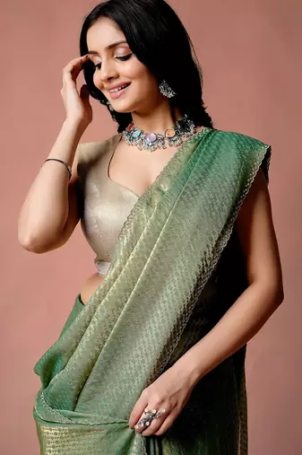 Green women ethnic motifs woven design saree