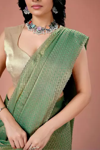 Green women ethnic motifs woven design saree