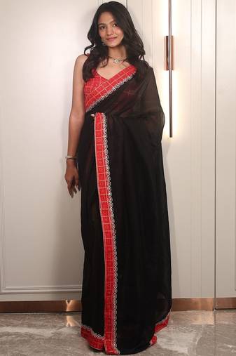 Black ethnic motifs embroidered satin saree
