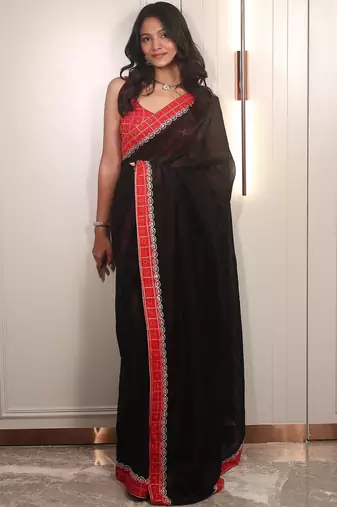 Black ethnic motifs embroidered satin saree