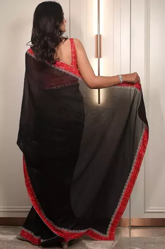 Black ethnic motifs embroidered satin saree