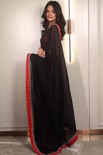 Black ethnic motifs embroidered satin saree