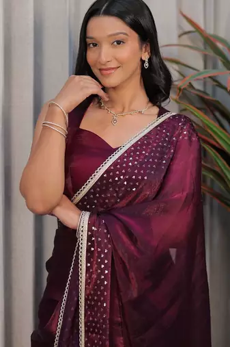 Burgundy ethnic motifs sequinned tissue heavy work saree