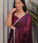 Burgundy ethnic motifs sequinned tissue heavy work saree