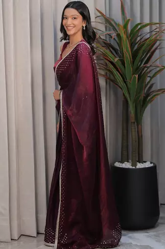 Burgundy ethnic motifs sequinned tissue heavy work saree