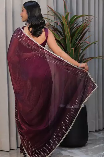 Burgundy ethnic motifs sequinned tissue heavy work saree