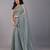 Sea green stonework embellished beads border silk saree with unstitched blouse