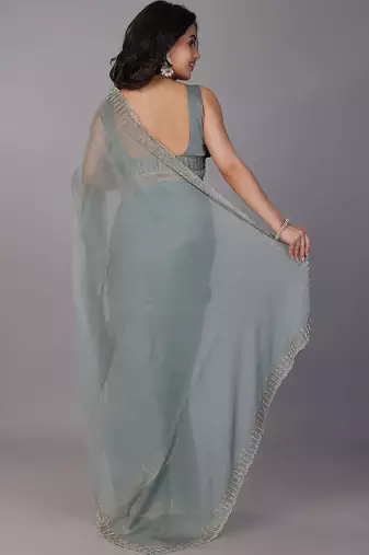 Sea green stonework embellished beads border silk saree with unstitched blouse