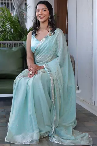 Turquoise sequinned silk cotton saree