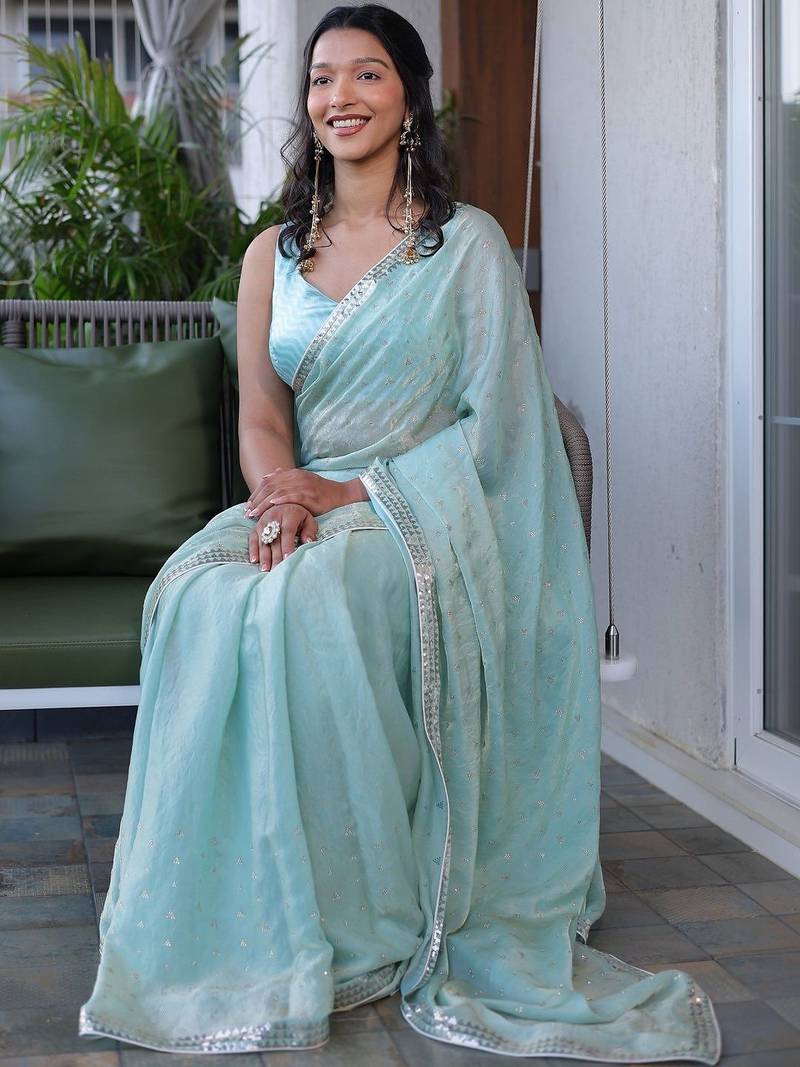 Turquoise sequinned silk cotton saree