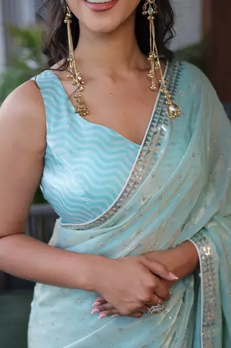 Turquoise sequinned silk cotton saree