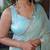 Turquoise sequinned silk cotton saree