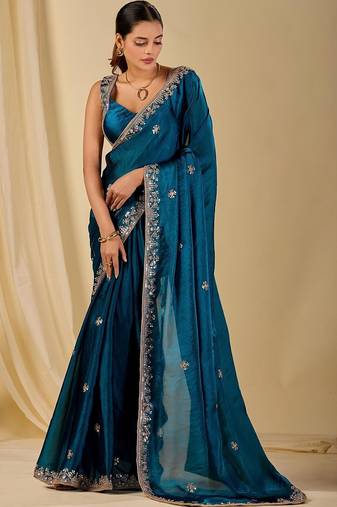 Teal ethnic motifs embroidered organza saree