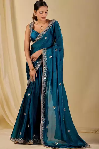 Teal ethnic motifs embroidered organza saree