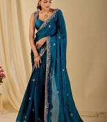 Teal ethnic motifs embroidered organza saree
