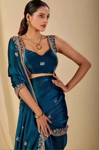 Teal ethnic motifs embroidered organza saree