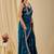 Teal ethnic motifs embroidered organza saree