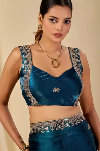 Teal ethnic motifs embroidered organza saree