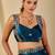 Teal ethnic motifs embroidered organza saree