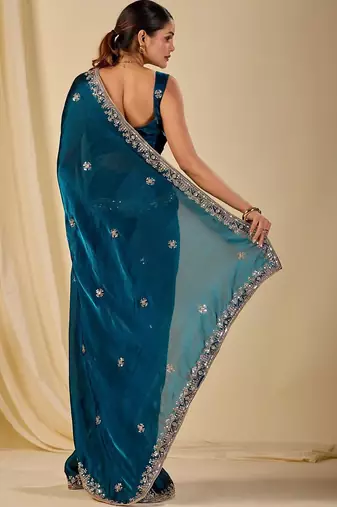 Teal ethnic motifs embroidered organza saree