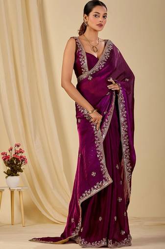 Purple ethnic motifs embroidered organza saree